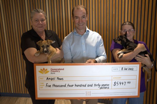 QLD Country Bank providing workplace giving cheque to Angel Paws.