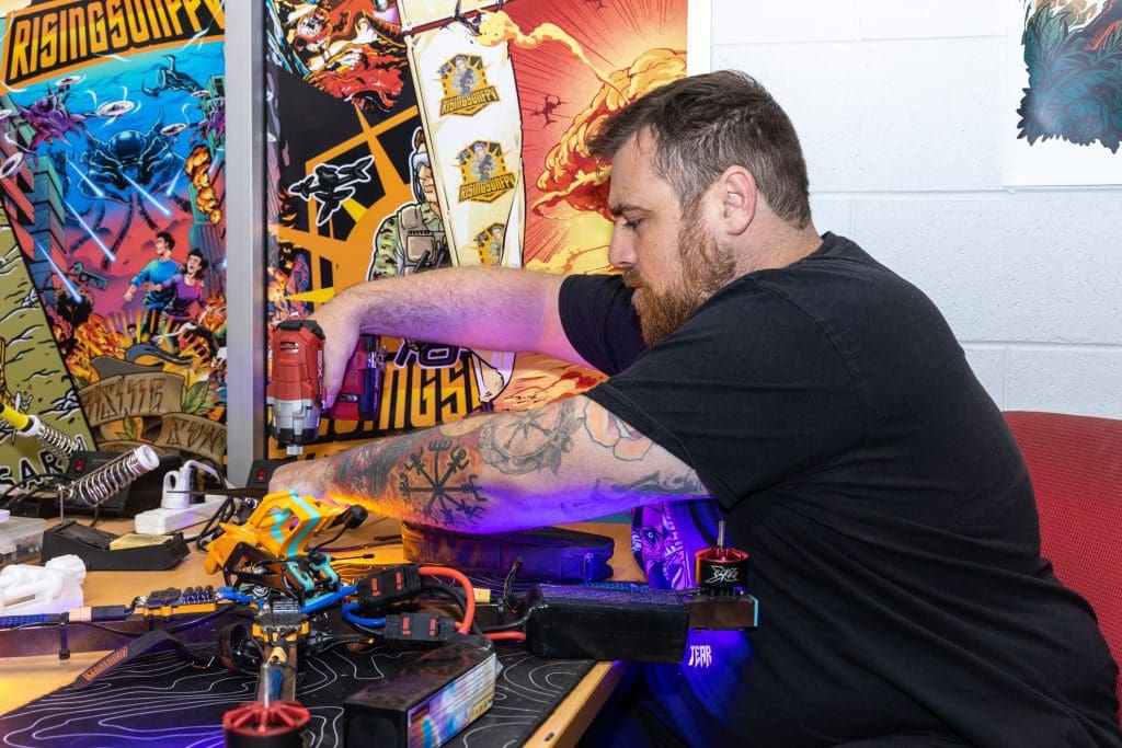 Zakariah Martin-Taylor repairing an FPV drone