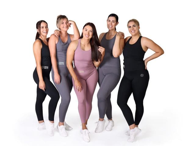 Five women wearing clothing produced by Strong Girls Co.