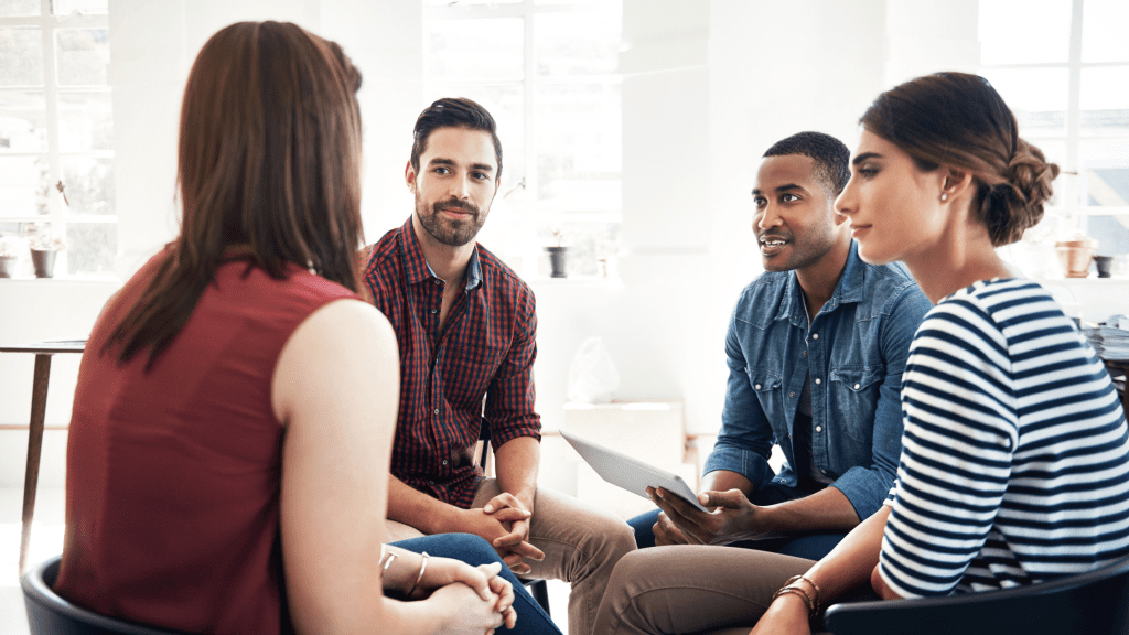 four people in a conversation