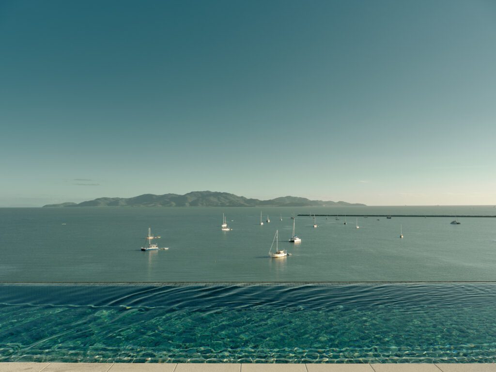 View from the Ardo Rooftop Bar & Restaurant over the infinity pool- Ardo Townsville. Townsville’s first luxury hotel is now taking bookings | BDmag November 2023