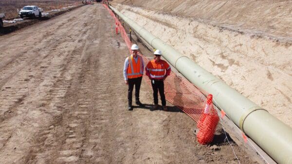 Councillor Kurt Rehbein (left) and Councillor Russ Cook inspecting Stage 2 of the Haughton Pipeline Project. BDmag, February 2024.