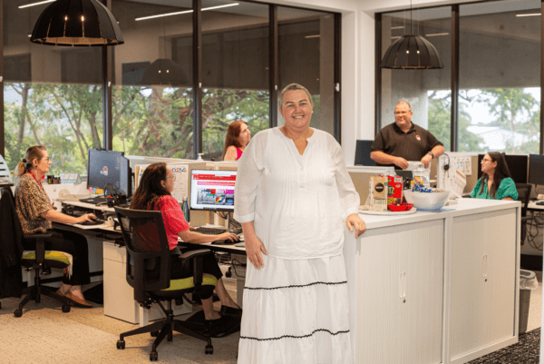 Jody Goldring with her collegues at TAFE Queensland who encouraged her to get a mammogram. BDmag Jan-Mar 2025.